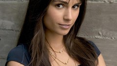 Wall woman close-up faces smiling long hair brown eyes 