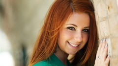 Wall woman enigma smiling green eyes redheads green dress