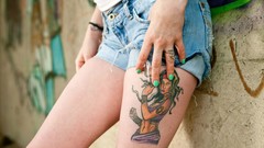 Wall woman jeans legs tattoos