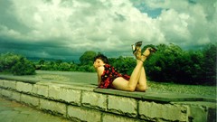 Wall woman retro dress legs outdoors brunettes short hair high 