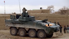 War children soldiers patrol tanks NATO Afghanistan apc Polish 