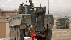War children soldiers patrol tanks NATO Afghanistan Villages 