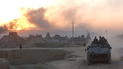 War smoke dust ruins soldiers military patrol tanks NATO 