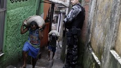 War weapons Guns police alley slum Rio de Janeiro Brazil raid 