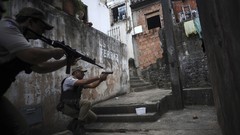 War weapons Guns police slum Rio de Janeiro Brazil raid pistols 