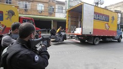 War weapons Guns police slum Rio de Janeiro Brazil raid trucks 