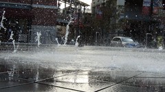 Water cars fountain Speed Utah wet Downtown splashes buildings 