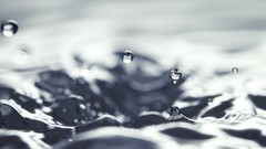 Water drops white waves splashes