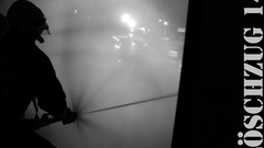 Water fire lights trucks phones firefighter