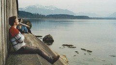 Water Mountains Men sitting sea shorelines waterscapes