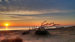 Water sunset clouds sand