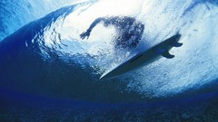 Waves surfing surfers