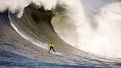 Waves surfing surfers
