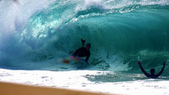 Waves surfing surfers