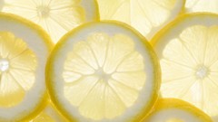 White background slices lemons fruits