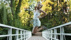 White woman Bridges blondes tank tops long hair jumping skinny 