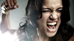 White woman teeth Michelle Rodriguez Actress fists punching