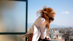 Wind woman glasses balcony sunny cityscapes