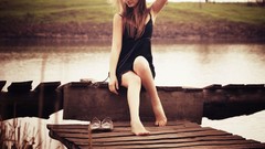 Wind woman piers legs blondes barefoot models black dress hair 