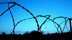 Wired fence blue sky