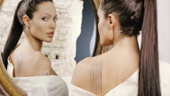 Woman Angelina Jolie reflections tattoos mirrors