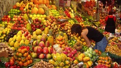 Woman apples oranges bananas fruits market