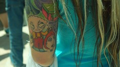 Woman arm Family Guy tattoos