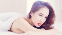 Woman asians lying down topless