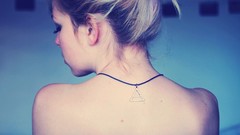 Woman back blondes necklaces