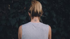 Woman back peace tattoos