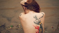 Woman back tattoos nude