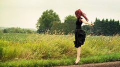 Woman barefoot jumping redheads