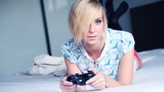 Woman bedroom blondes gamepad models lying down joysticks