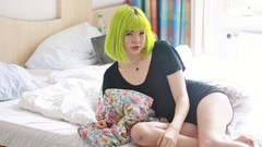 Woman beds barefoot green hair