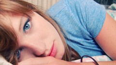 Woman beds faces blue eyes self shot