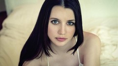 Woman beds long hair green eyes brunettes