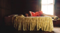 Woman beds lying down