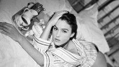 Woman beds Monica Bellucci lying down grayscale
