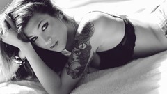 Woman beds tattoos bra underwear grayscale