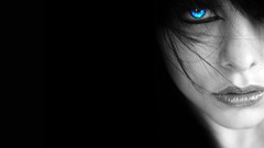 Woman black background faces blue eyes