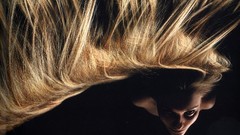 Woman black background faces waves blondes Ukraine long hair