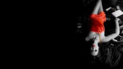 Woman black background red dress electronics lying down red 