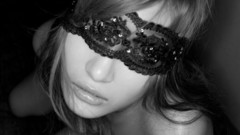 Woman blindfolds monochrome faces