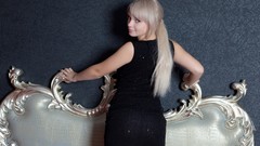 Woman blondes black dress looking back Feeona A
