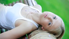 Woman blondes blue eyes lying down