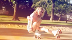 Woman blondes laughing rollerskates roller skates