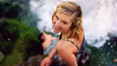 Woman blondes smiling looking up depth of field