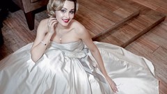 Woman blondes smiling white dress