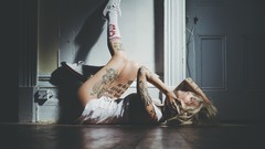 Woman blondes tattoos lying down Sara Fabel