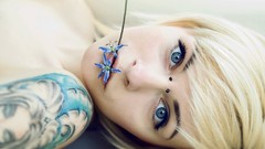 Woman blondes tattoos pierced nose